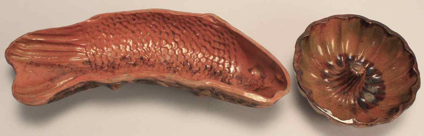 Appraisal: TWO REDWARE MOLDS th CenturyTurk's head diameter and fish-form length