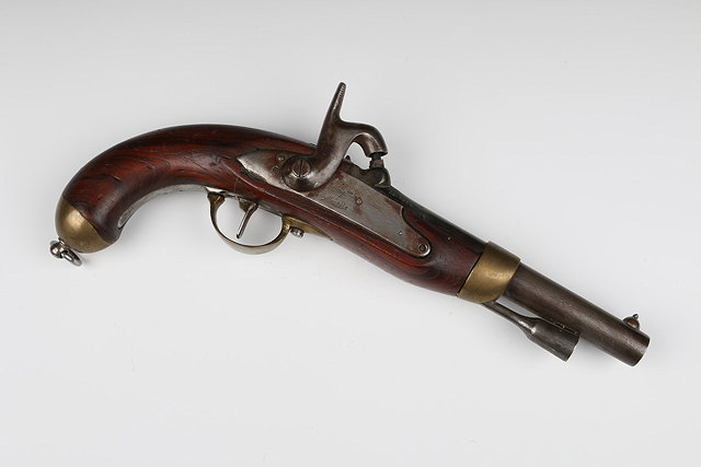 Appraisal: A FRENCH FLINTLOCK PISTOL brass mounted with walnut stock stamped