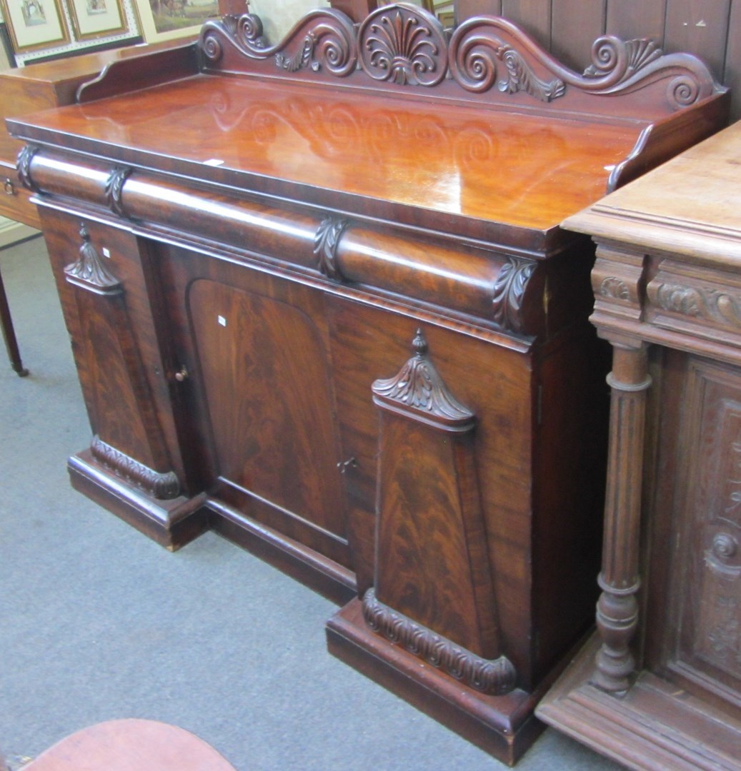 Appraisal: A small William IV mahogany sideboard with scroll galleried back