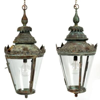 Appraisal: A pair of copper framed hall lanterns with crown tops