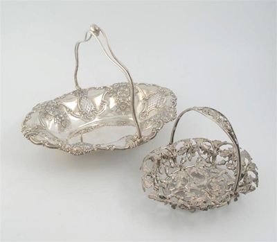 Appraisal: A modern swing handled cake basket of shaped oval outline