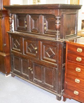 Appraisal: An th Century oak court cupboard enclosed by five panel