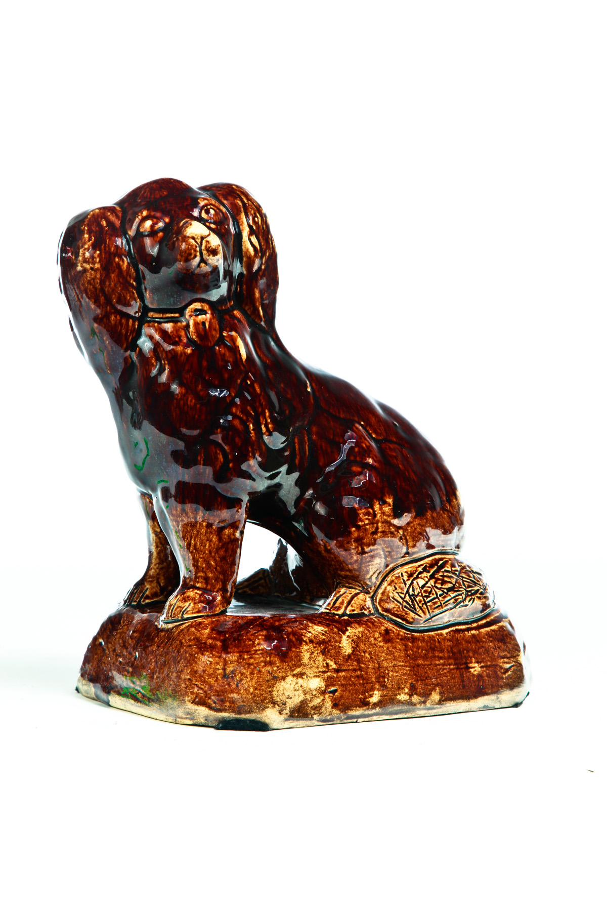 Appraisal: AMERICAN ROCKINGHAM DOG Mid th century Seated spaniel with freestanding