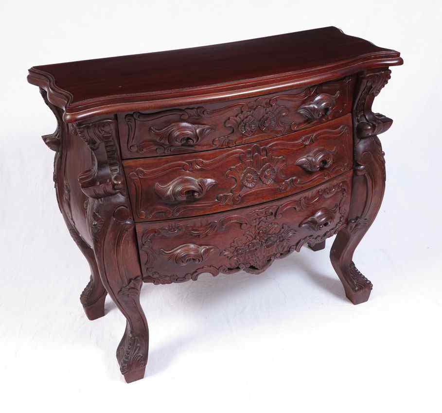 Appraisal: CARVED MAHOGANY BOMBAY COMMODE Indonesian mahogany drawer chest ''h x