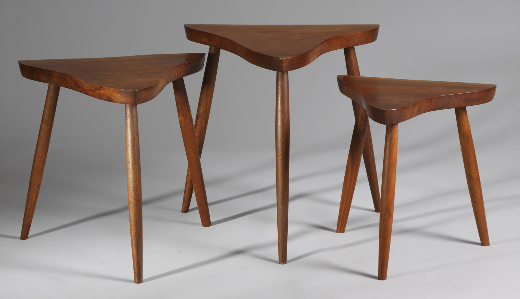 Appraisal: George Nakashima Set of Walnut Nesting Tables Condition Original patina