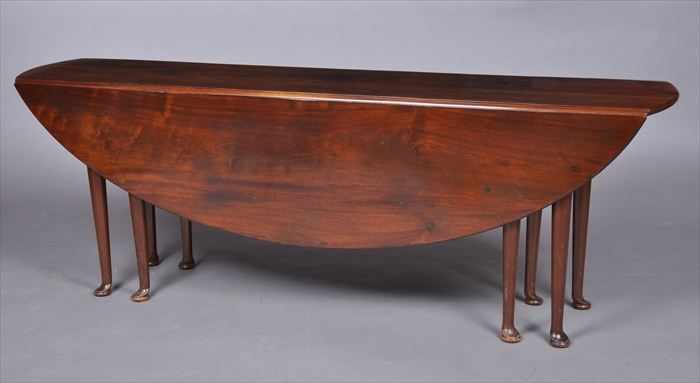 Appraisal: GEORGE III MAHOGANY GATE-LEG WAKE TABLE The top with bowed