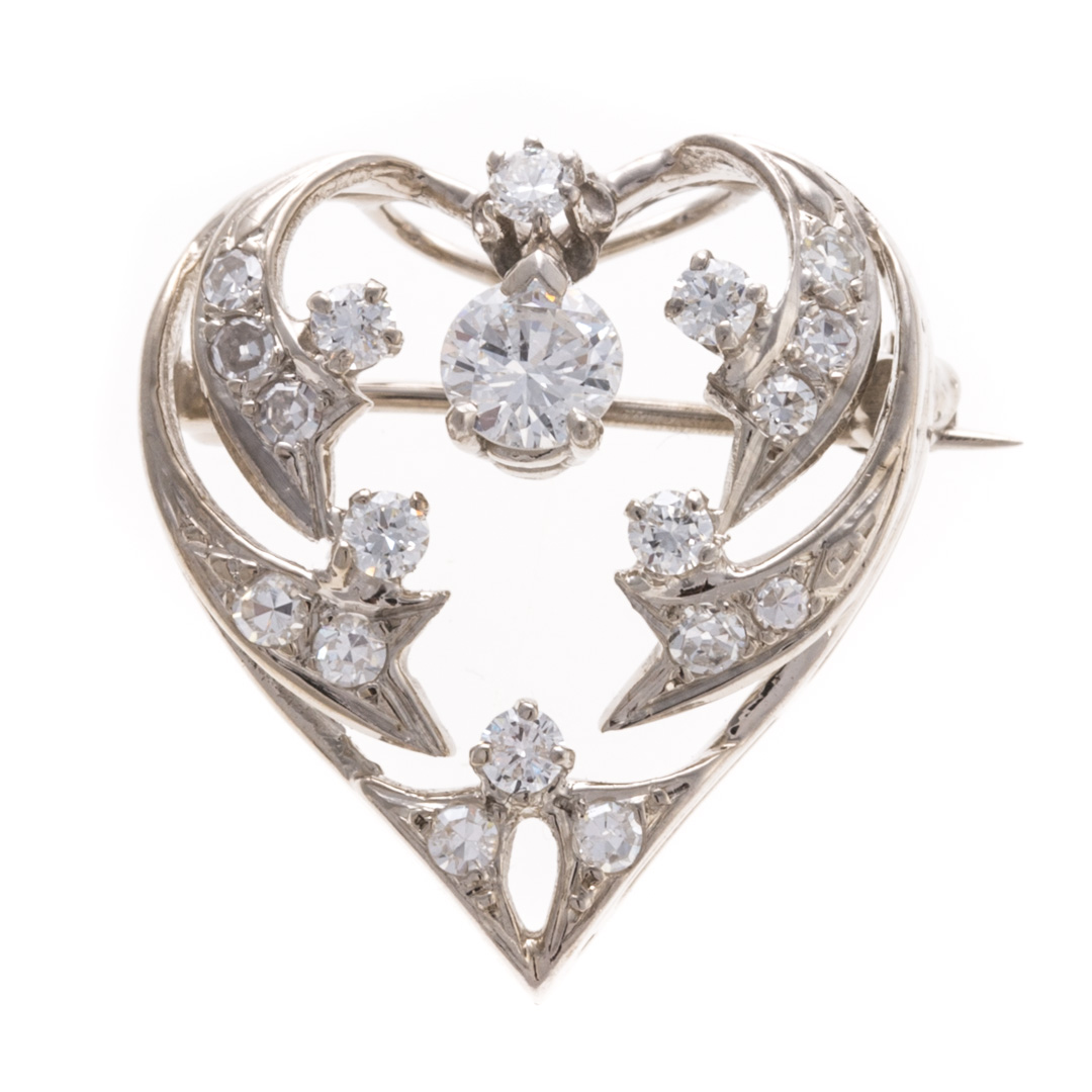 Appraisal: A Lady's Platinum Diamond Heart Pin Pendant Platinum pin pendant