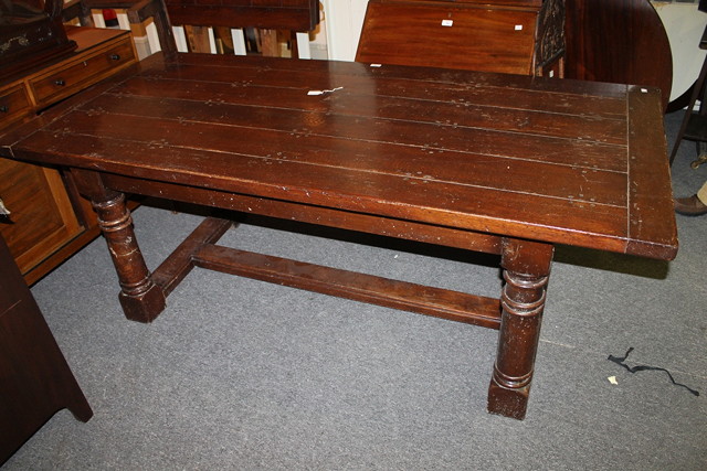 Appraisal: AN OAK REFECTORY TABLE with turned supports the rectangular top