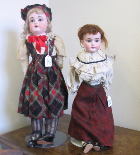 Appraisal: TWO BISQUE SHOULDER HEAD GIRL DOLLS One a copy of