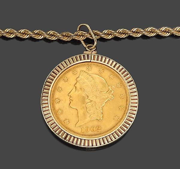 Appraisal: A gold coin pendant and chain suspending a U S