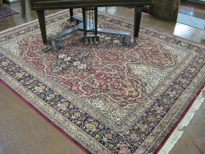 Appraisal: FINE HAND KNOTTED ORIENTAL CARPET Indo-Persian floral and double floral