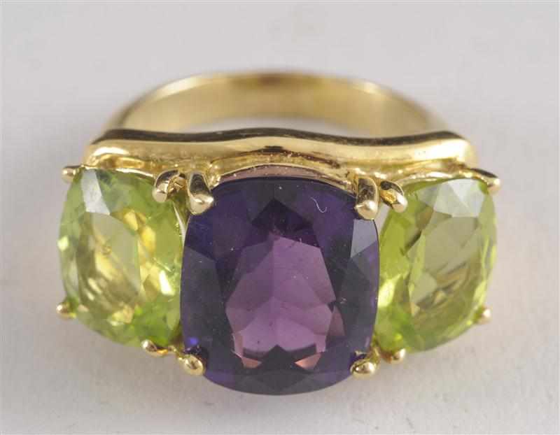 Appraisal: PERIDOT AND AMETHYST K GOLD COCKTAIL RING Provenance The Estate