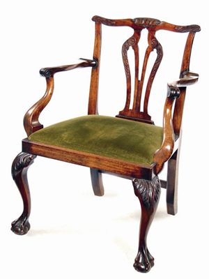 Appraisal: A mid th century mahogany open armchair the undulating top