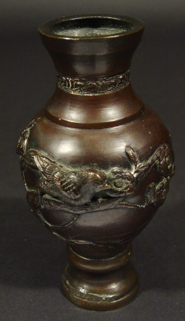 Appraisal: Japanese bronze vase cast in relief with a continuous band