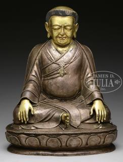 Appraisal: BRONZE STATUE OF A SEATED FIGURE th century China The