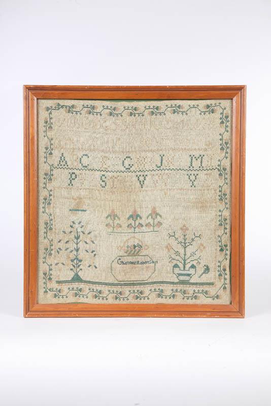 Appraisal: SAMPLER Finely stitched alphabets potted flowers birds and vining border