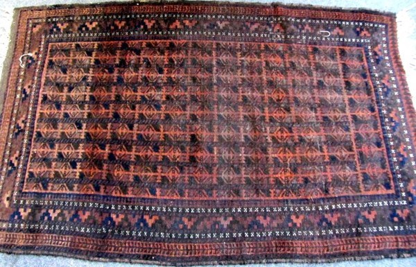 Appraisal: A Beluchistan rug the madder field with rows of simple