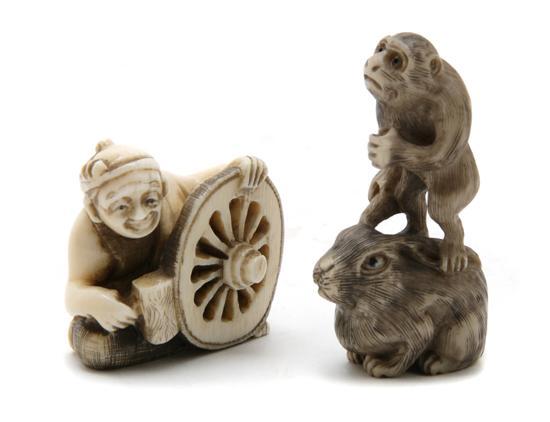 Appraisal: Group of Two Japanese Carved Netsukes the first depicting a