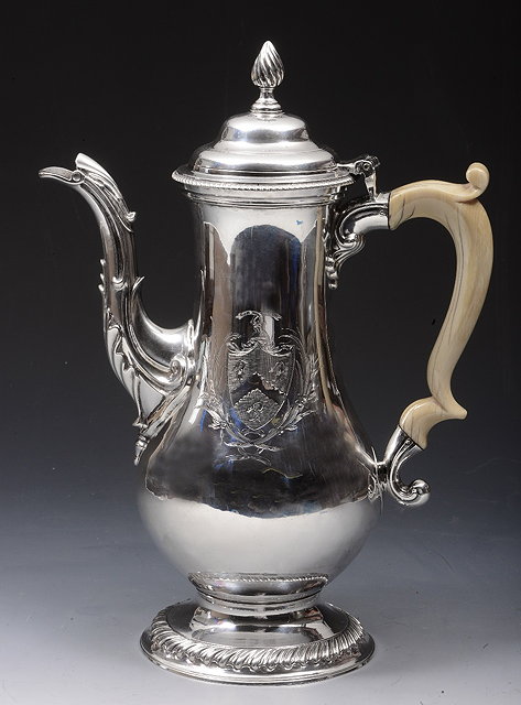 Appraisal: A GEORGE III SILVER COFFEE POT of baluster form and