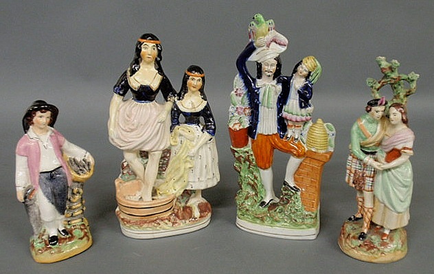 Appraisal: Four colorful Staffordshire figural groups all c largest h