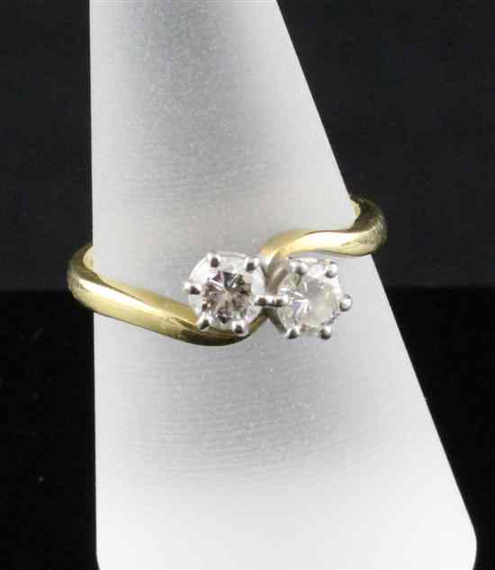 Appraisal: An ct gold two stone diamond crossover ring total weight