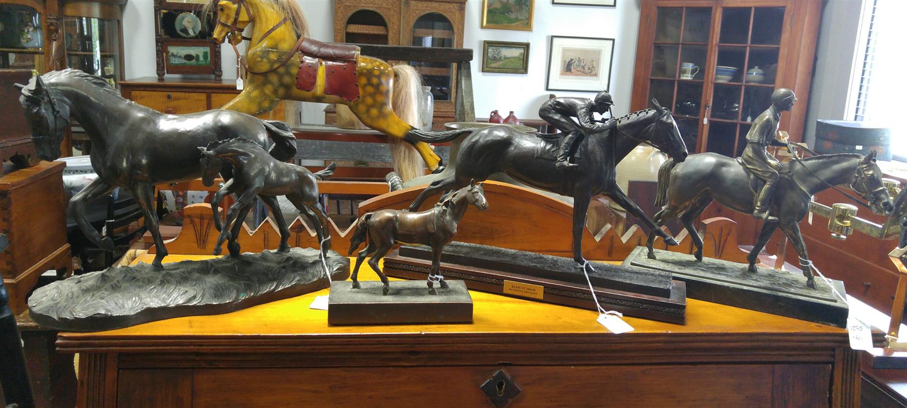 Appraisal: FOUR HORSE FIGURINES American th century Spelter Man O' War