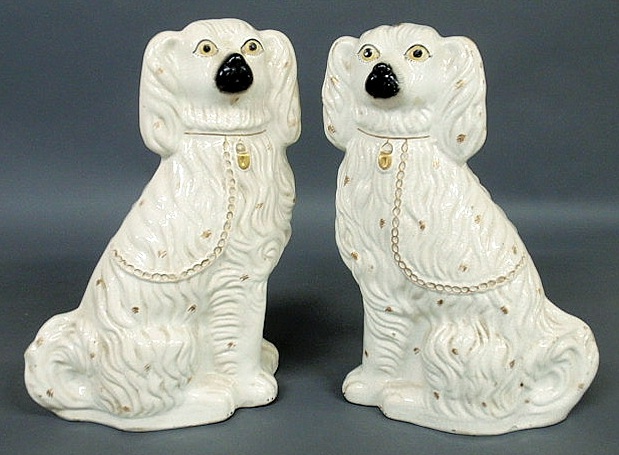 Appraisal: Large pair of Staffordshire white seated Spaniels c h x