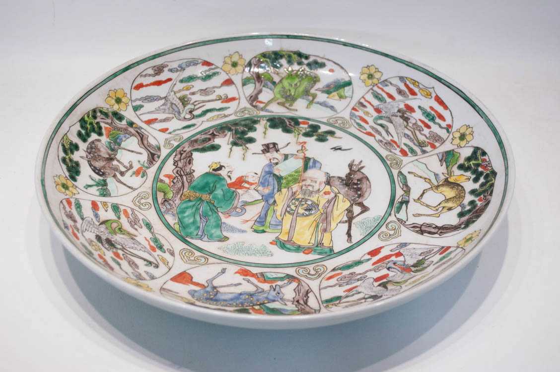 Appraisal: CHINESE QING PORCELAIN WUCAI CHARGER hand enameled with central reserve