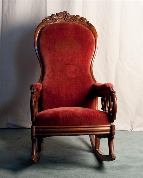 Appraisal: A th C Rococo Revival Rocker with carved crest red