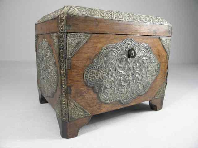 Appraisal: A th century miniature wooden chest with embossed silver mounts