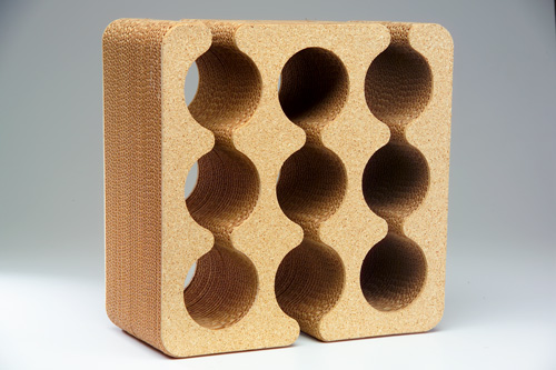 Appraisal: FRANK GEHRY Cork and corrugated cardboard wine rack with nine-bottle