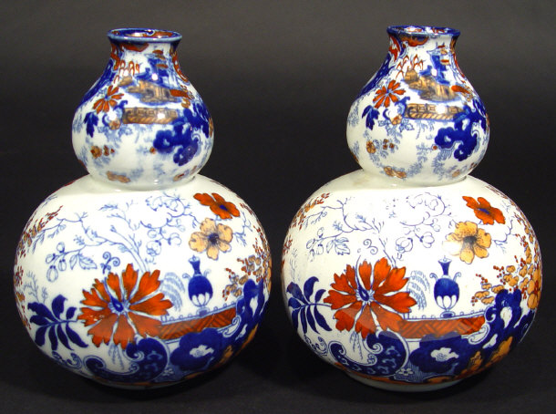 Appraisal: Pair of Edwardian double gourd china vases hand coloured and