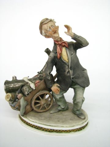 Appraisal: Guiseppe Cappe Capodimonte Figurine depicting man with barrel of goods