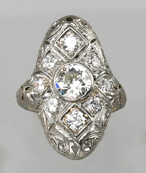 Appraisal: A diamond platinum and k white gold filigree ring estimated