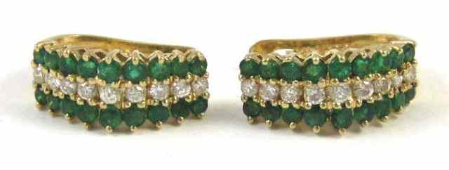 Appraisal: PAIR OF EMERALD AND DIAMOND EARRINGS each k yellow gold