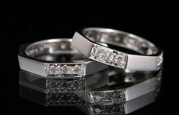 Appraisal: A Pair of Handsome Gold and Diamond Bands k white