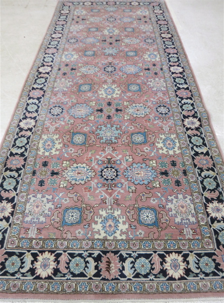 Appraisal: PERSIAN TRIBAL CARPET hand knotted in an overall geometric and