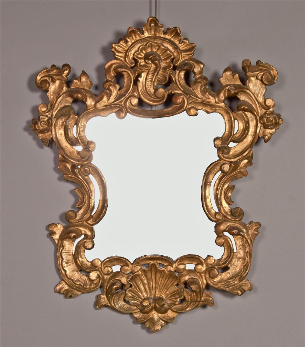 Appraisal: ROCOCO STYLE GILTWOOD MIRROR late th Century with a shell