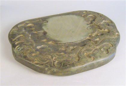 Appraisal: Chinese Duan inkstone th century Of naturalistic oval form carved