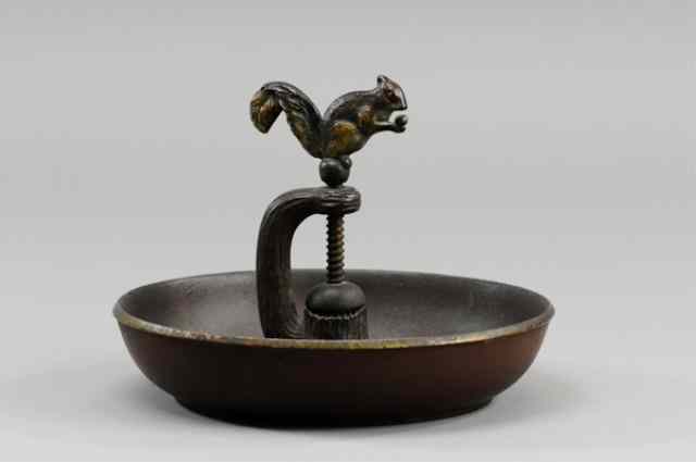 Appraisal: CAST IRON SQUIRREL NUT CRACKER AND BOWL Early squirrel casting