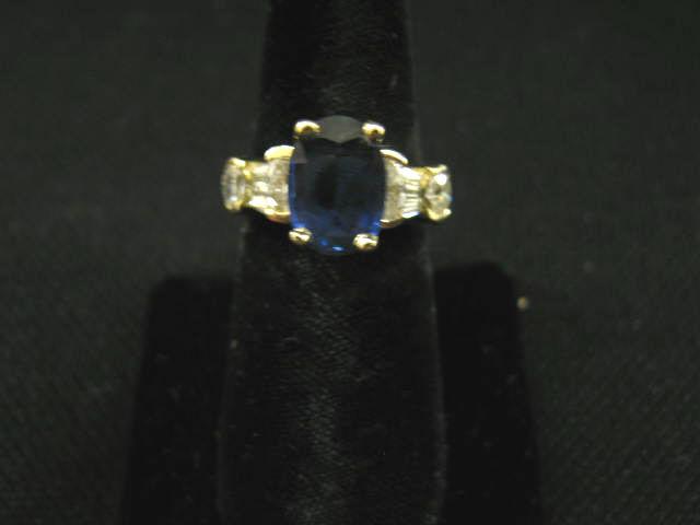 Appraisal: Sapphire Diamond Ring oval gem with oval baguette diamonds totaling