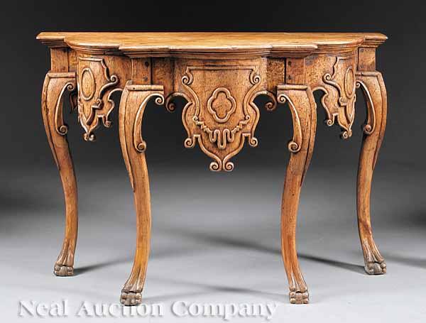 Appraisal: A Carved Walnut Console Table in the Georgian Taste antique