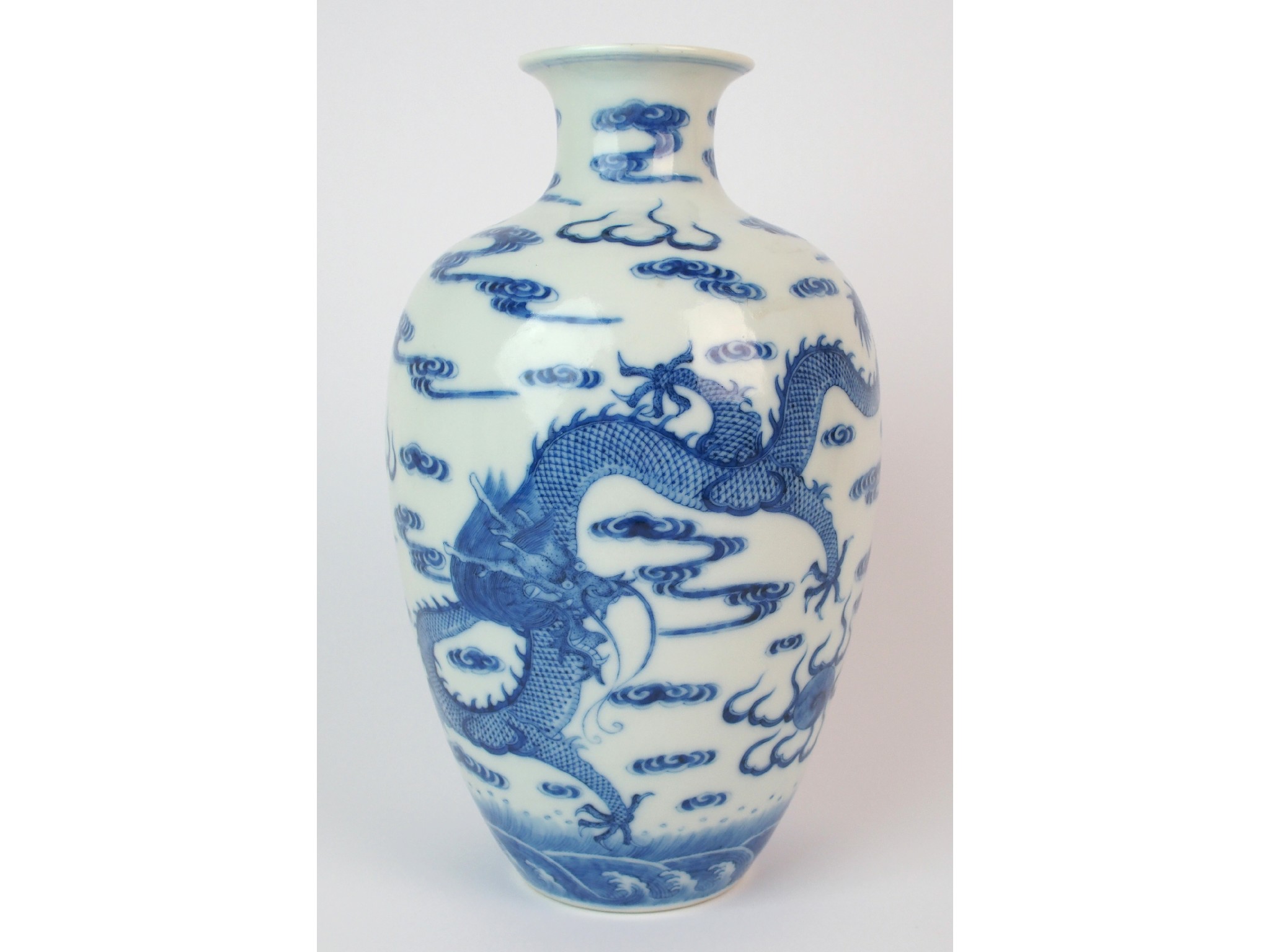 Appraisal: A Chinese blue and white vasepainted with dragons amongst cloud