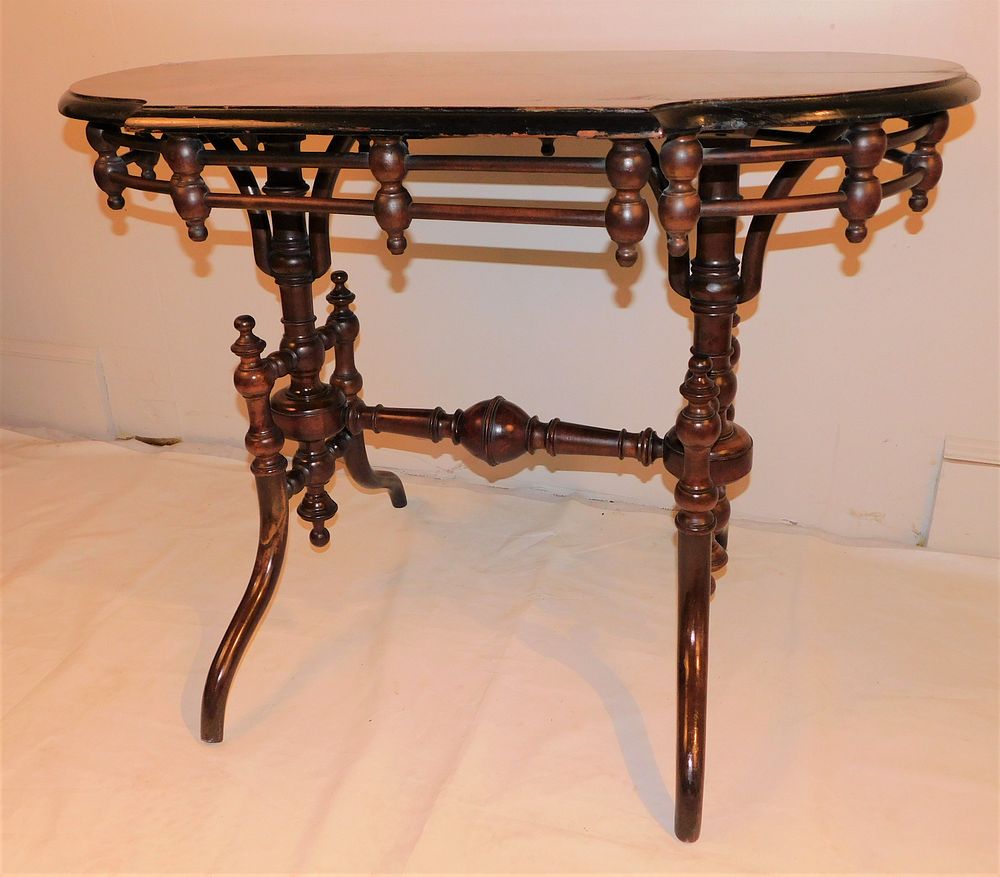 Appraisal: VICTORIAN STICK AND BALL TABLE Victorian walnut Aesthetic sofa table