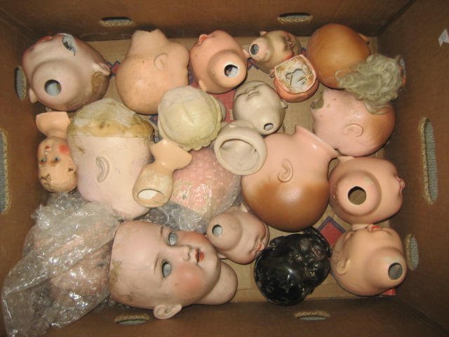 Appraisal: Twenty two mainly bisque dolls heads German and others various