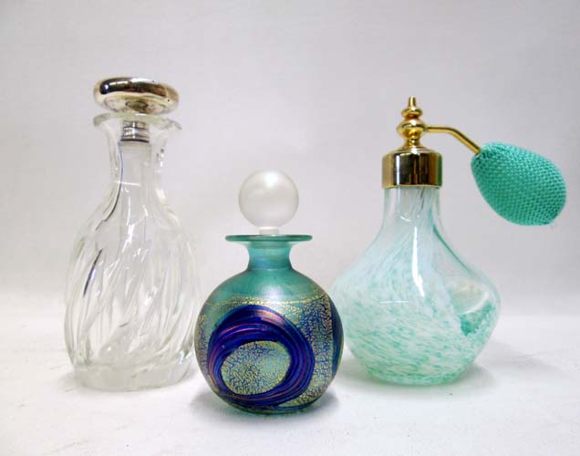 Appraisal: THREE COLLECTIBLE PERFUME BOTTLES cut glass with sterling capped stopper