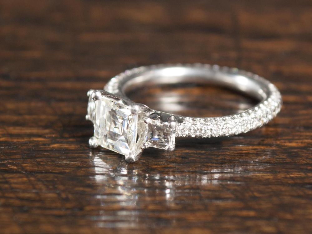 Appraisal: ESTATE DIAMOND AND PLATINUM RING WITH APPRAISAL The diamond encrusted