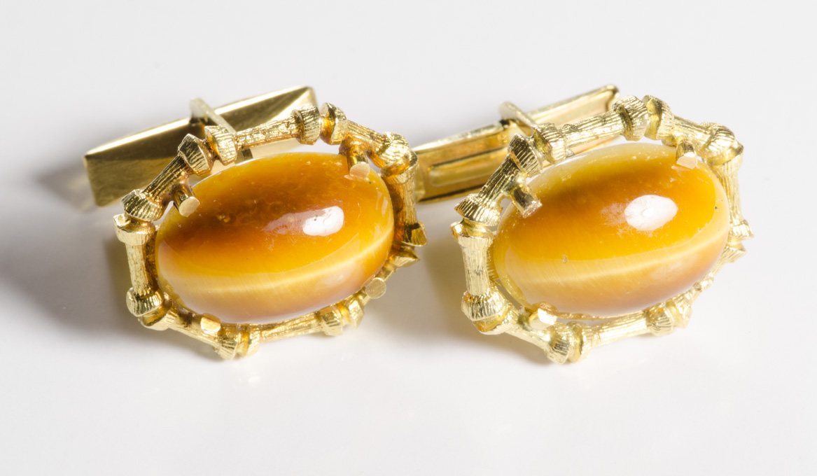 Appraisal: PAIR OF TIGER'S EYE CUFFLINKS each k yellow gold set