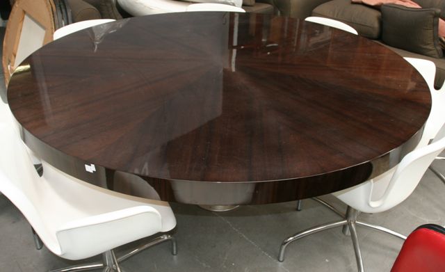 Appraisal: A walnut veneered and aluminium circular adjustable table by Metal