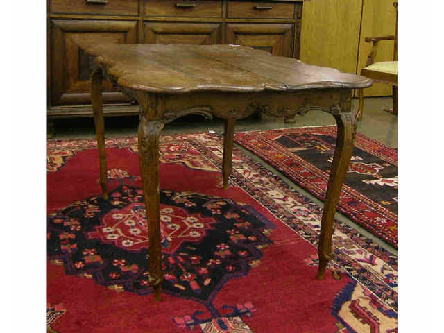 Appraisal: Carved antique Country French oak breakfast table top has a